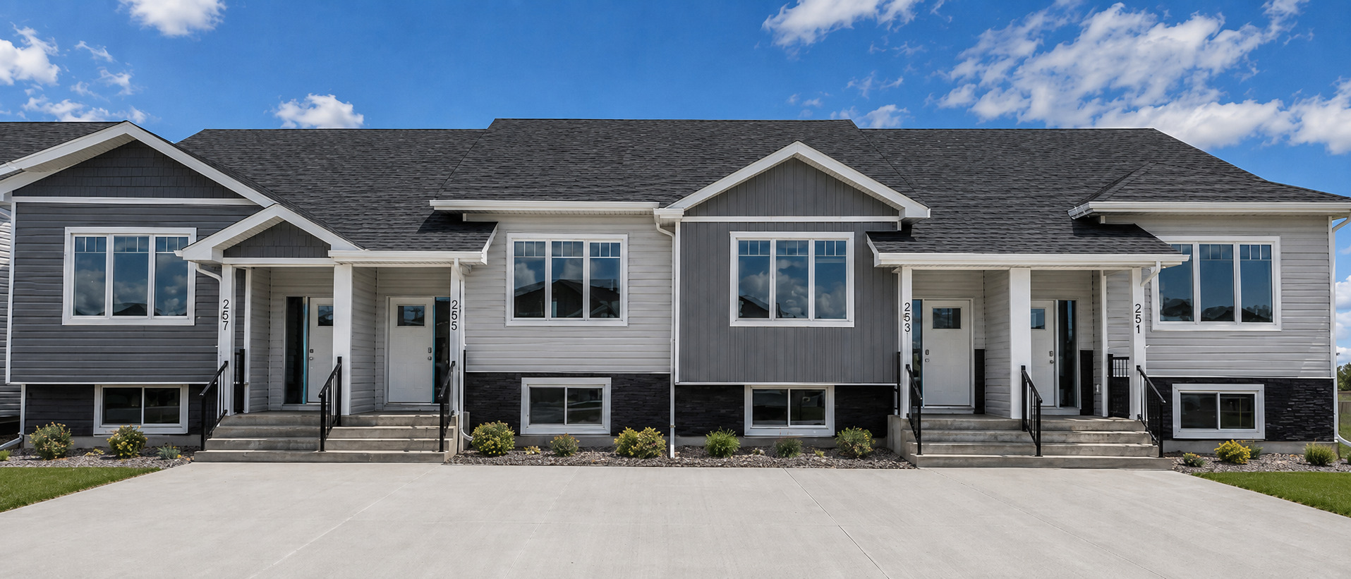 Completed four-unit rental development with coordinated modern exterior finishes and private entries. Completed four-unit rental development with coordinated modern exterior finishes and private entries.