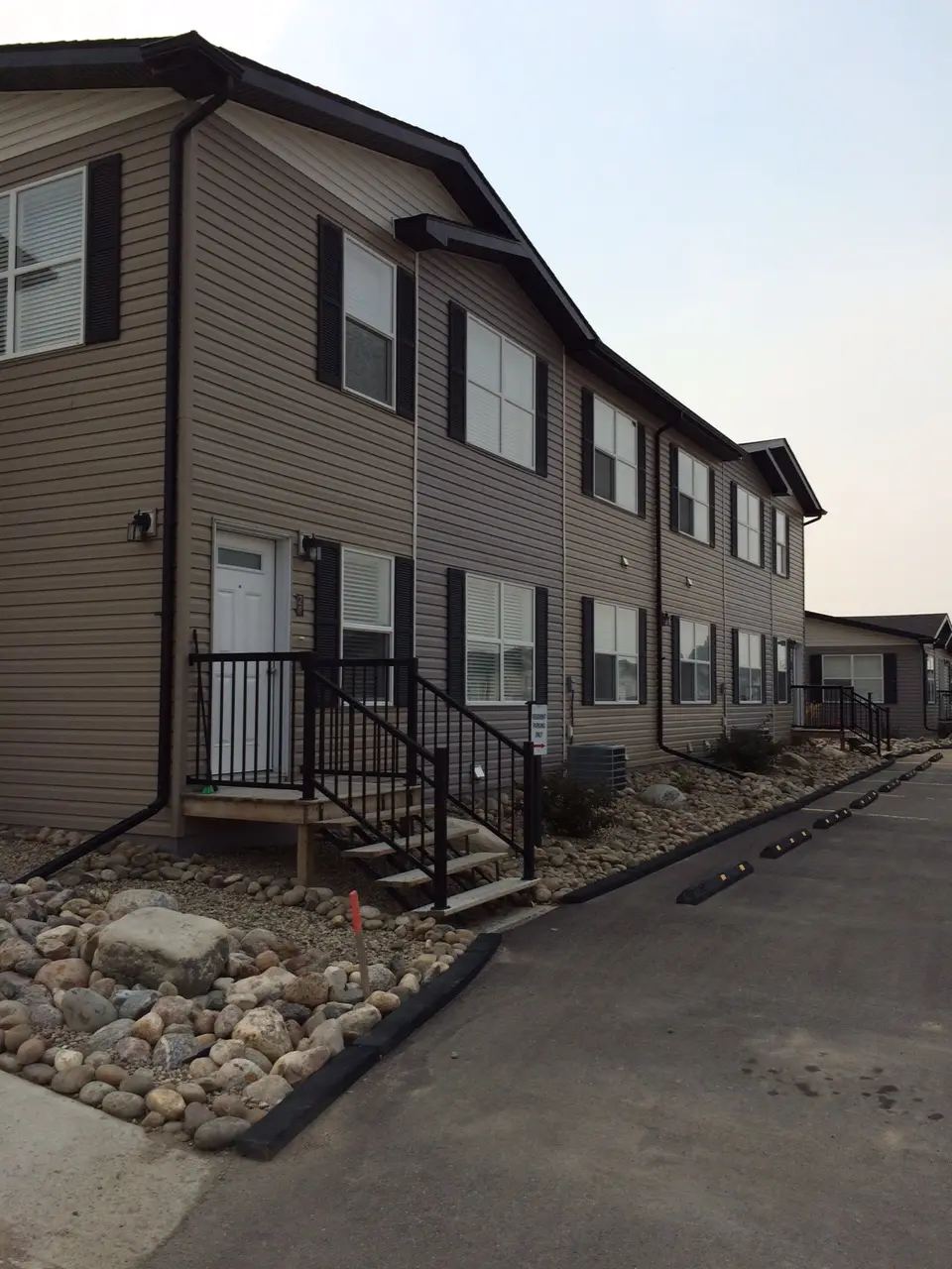 Completed multi-family row housing designed for durable long-term rental ownership. Completed multi-family row housing designed for durable long-term rental ownership.
