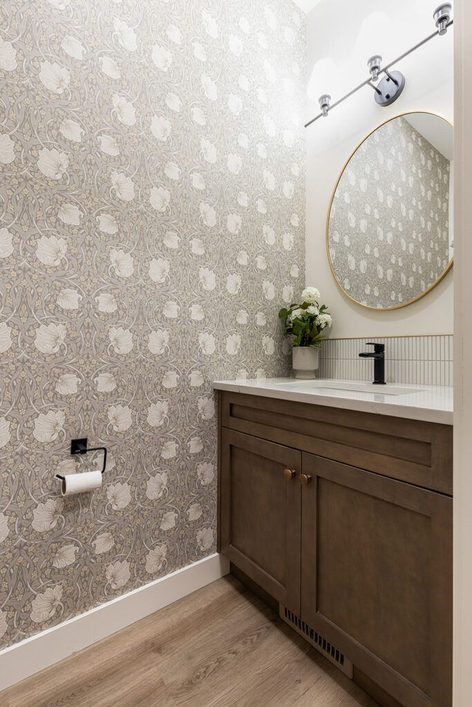 The Devon — powder room with patterned feature wall and custom wood vanity