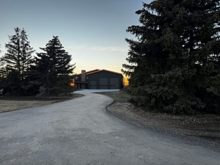 Custom Barndominium — long private approach to the combined home and shop