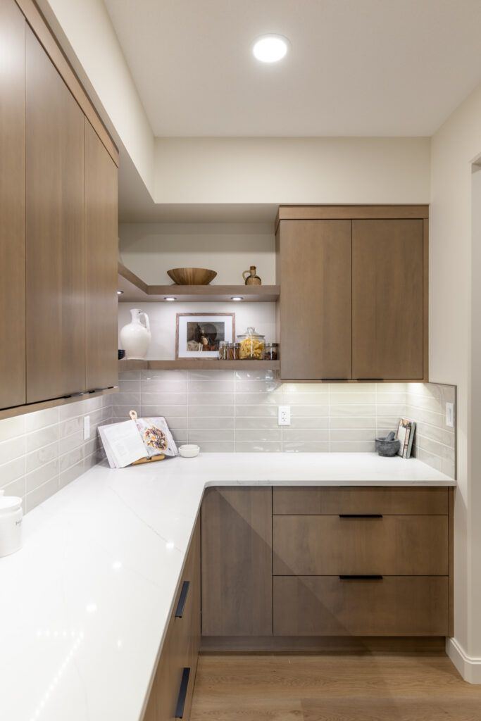 The Fairview — walk-through butler’s pantry with extensive counter and cabinet space