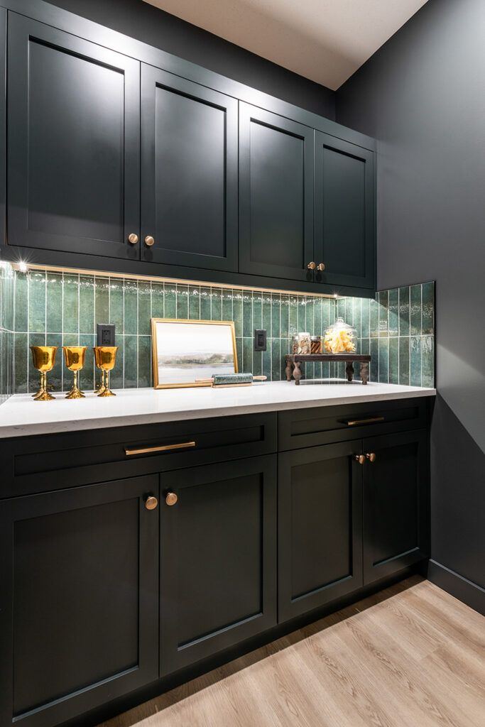 The Devon — built-in beverage and entertaining station with dark cabinetry and green tile