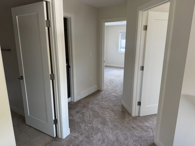 Upper hallway connecting bedrooms and bathrooms