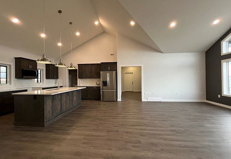 Custom Everest I Prairie Edition — open custom kitchen connected to the vaulted living area