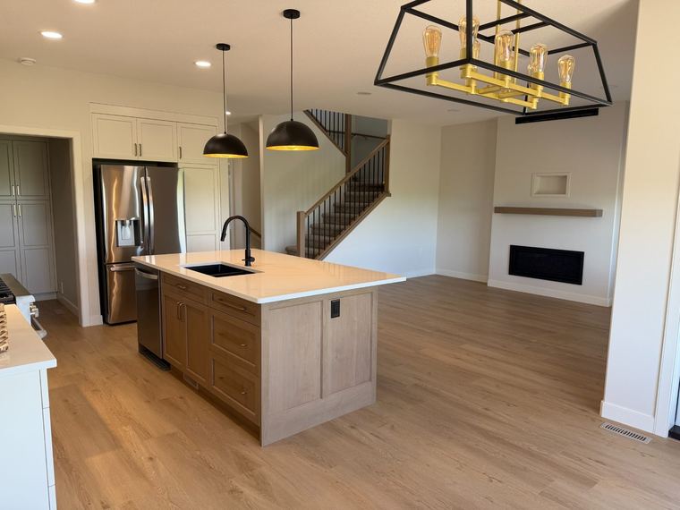 Open-concept kitchen, dining and living area