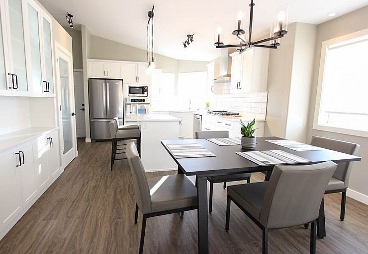 Renovation I — bright white kitchen with quartz countertops and luxury vinyl plank flooring
