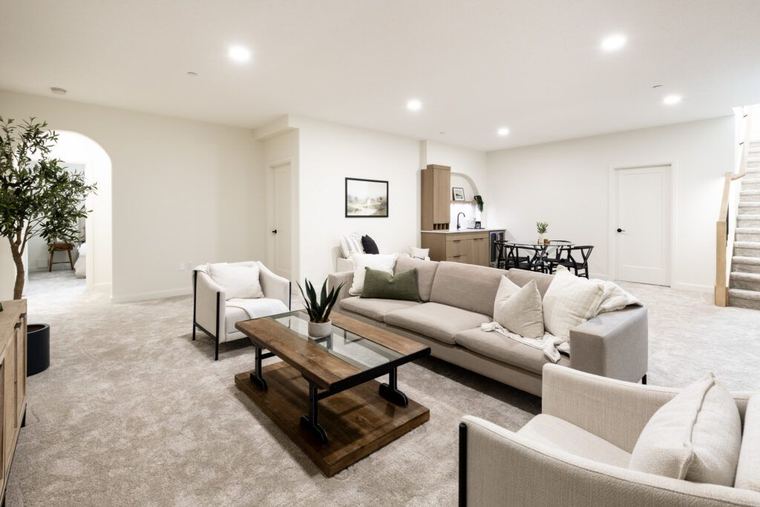 The Fairview — finished basement family room with adjacent wet bar and dining area