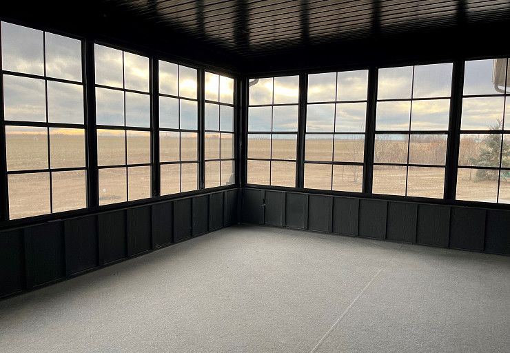 Custom Everest I Prairie Edition — enclosed sunroom with panoramic prairie views