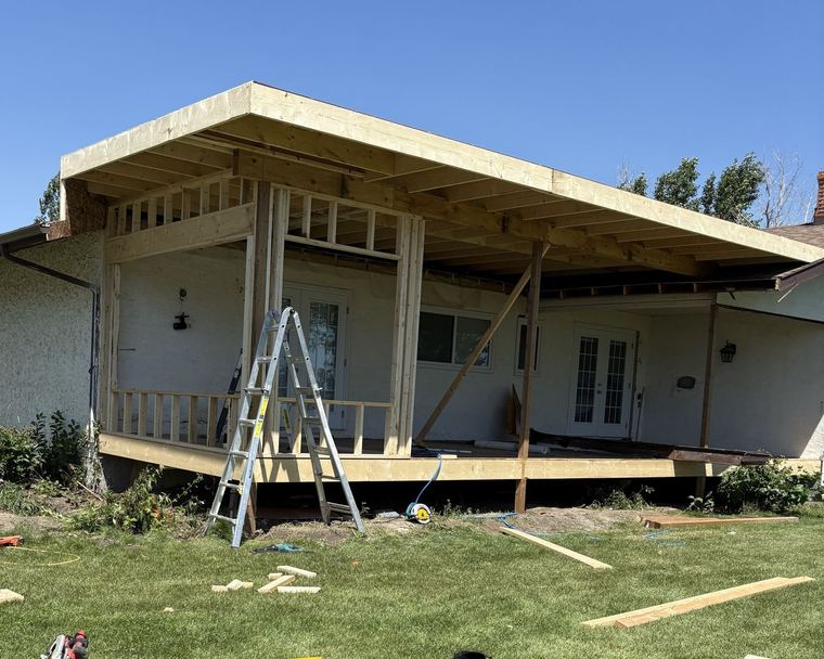 Renovation and covered-patio framing in progress