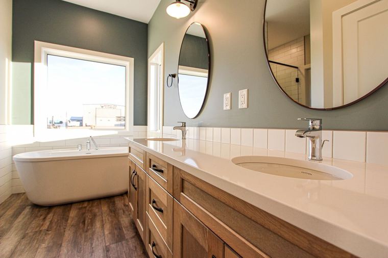 Acreage RTM — primary ensuite with double vanity and freestanding tub