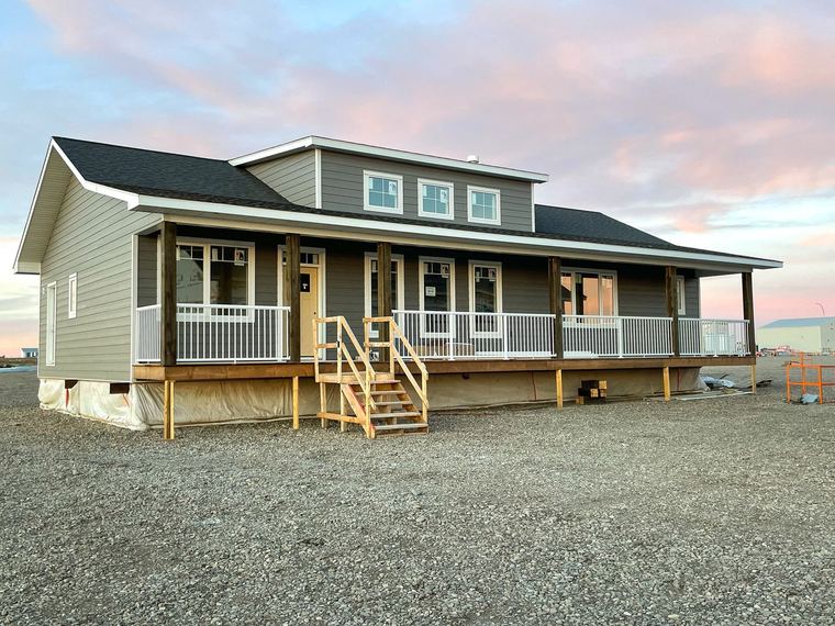 RTM showhome — completed exterior with full-width covered veranda