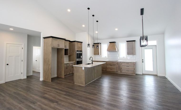 RTM showhome — open kitchen with custom cabinetry and coordinated lighting