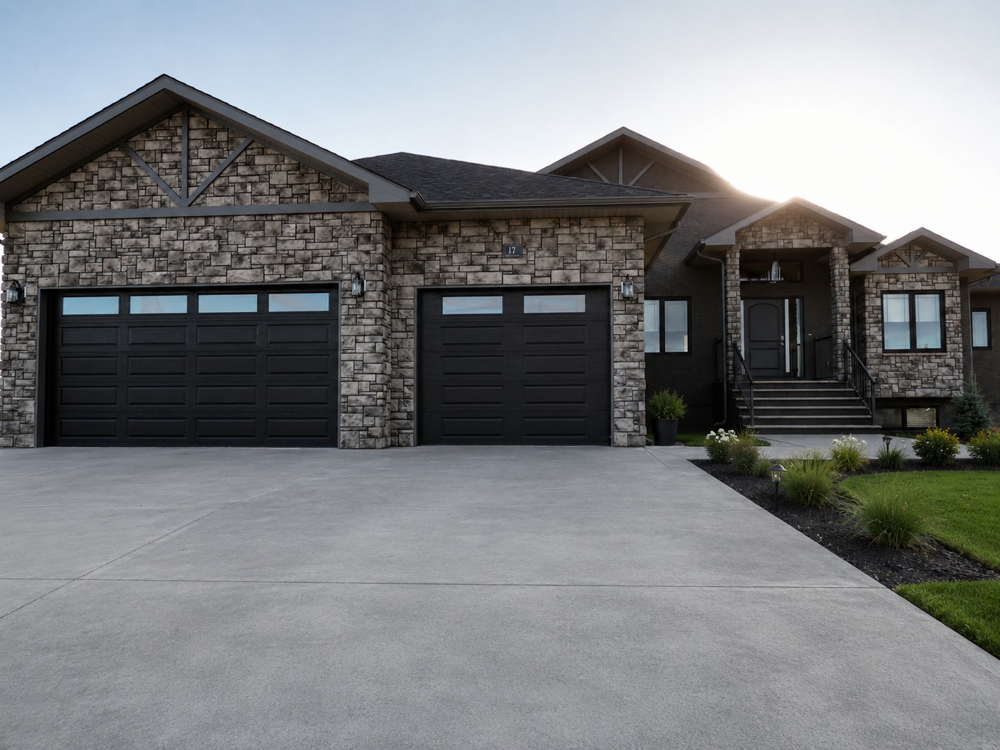 Completed custom dream home with stone exterior and three-car garage