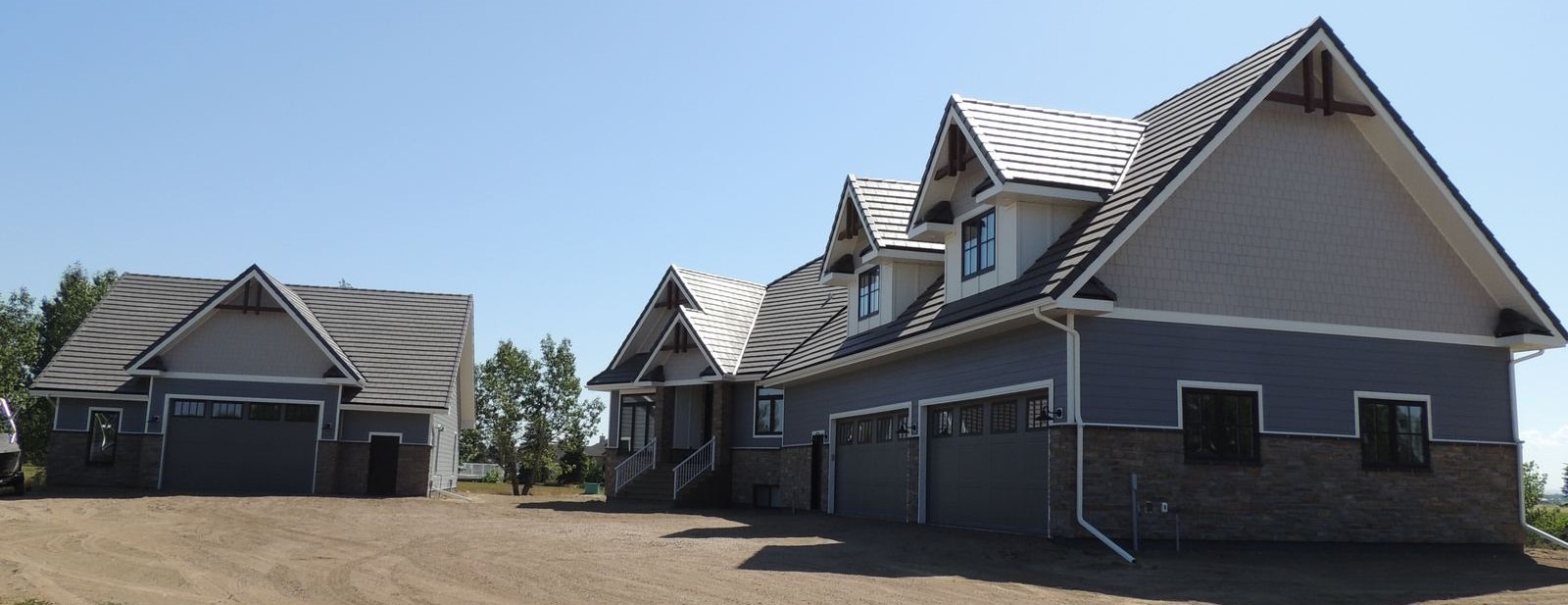 Completed custom on-site home with detached garage on a rural property